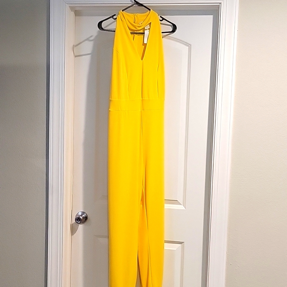 Yellow jumper two with a slit on each pants leg